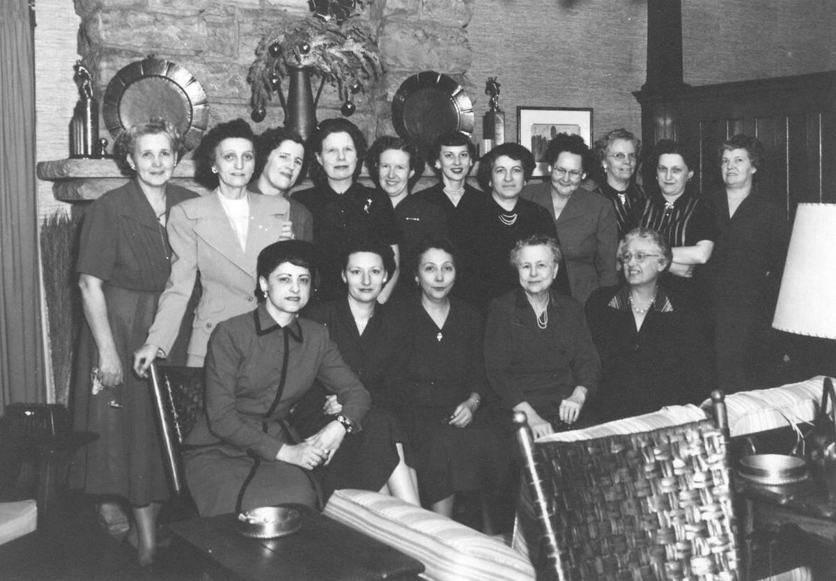 Nell Donnelly Reed (seated, first at left) and employees of the Donnelly Garment Company, no date. KANSAS CITY PUBLIC LIBRARY