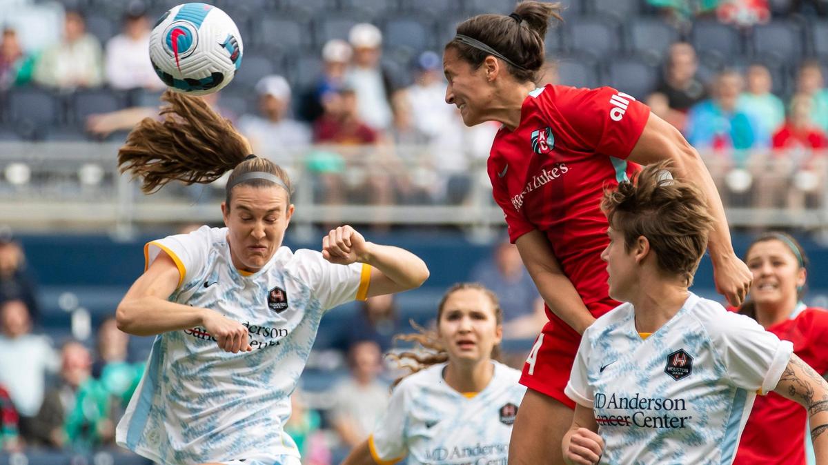 Kansas City defender Taylor Leach, top right, heads the ball toward the goal during Sunday’s NWSL match against the Houston Dash at Children’s Mercy Park in Kansas City, Kansas.