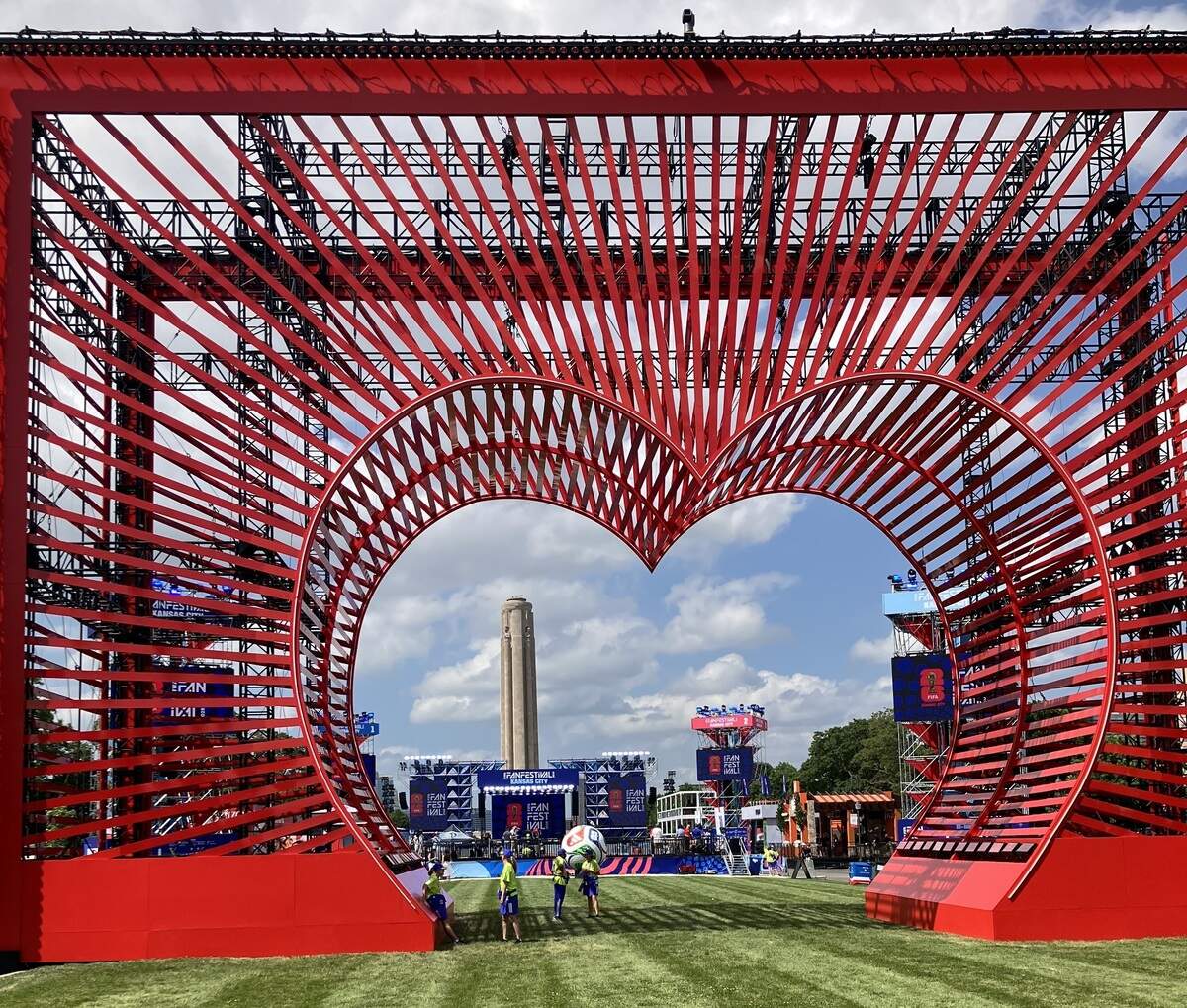 This 65-foot heart-shaped entrance — welcome to the Heartland — greets visitors to the 2026 FIFA World Cup Fan Fest site in Kansas City. Several local restaurants and a huge FIFA store are also part of the grounds, pictured here on Tuesday, June 9, 2026.
