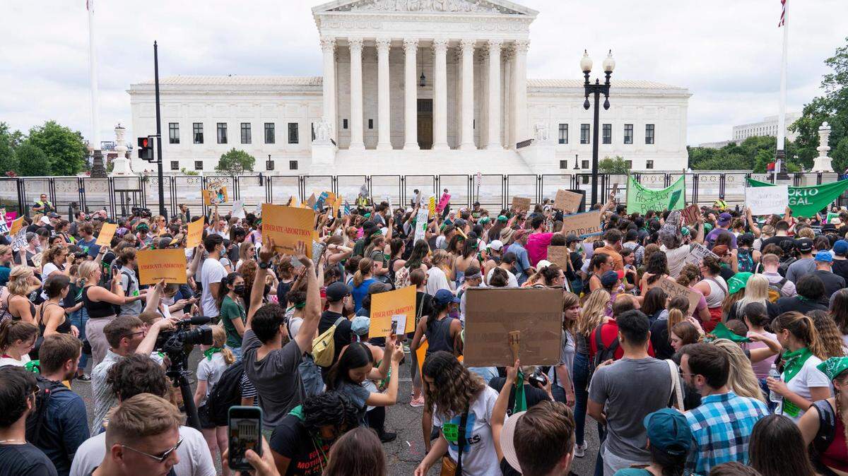 Protesters gather outside the Supreme Court in Washington, Friday, June 24, 2022. The Supreme Court has ended constitutional protections for abortion that had been in place nearly 50 years, a decision by its conservative majority to overturn the court’s landmark abortion cases.