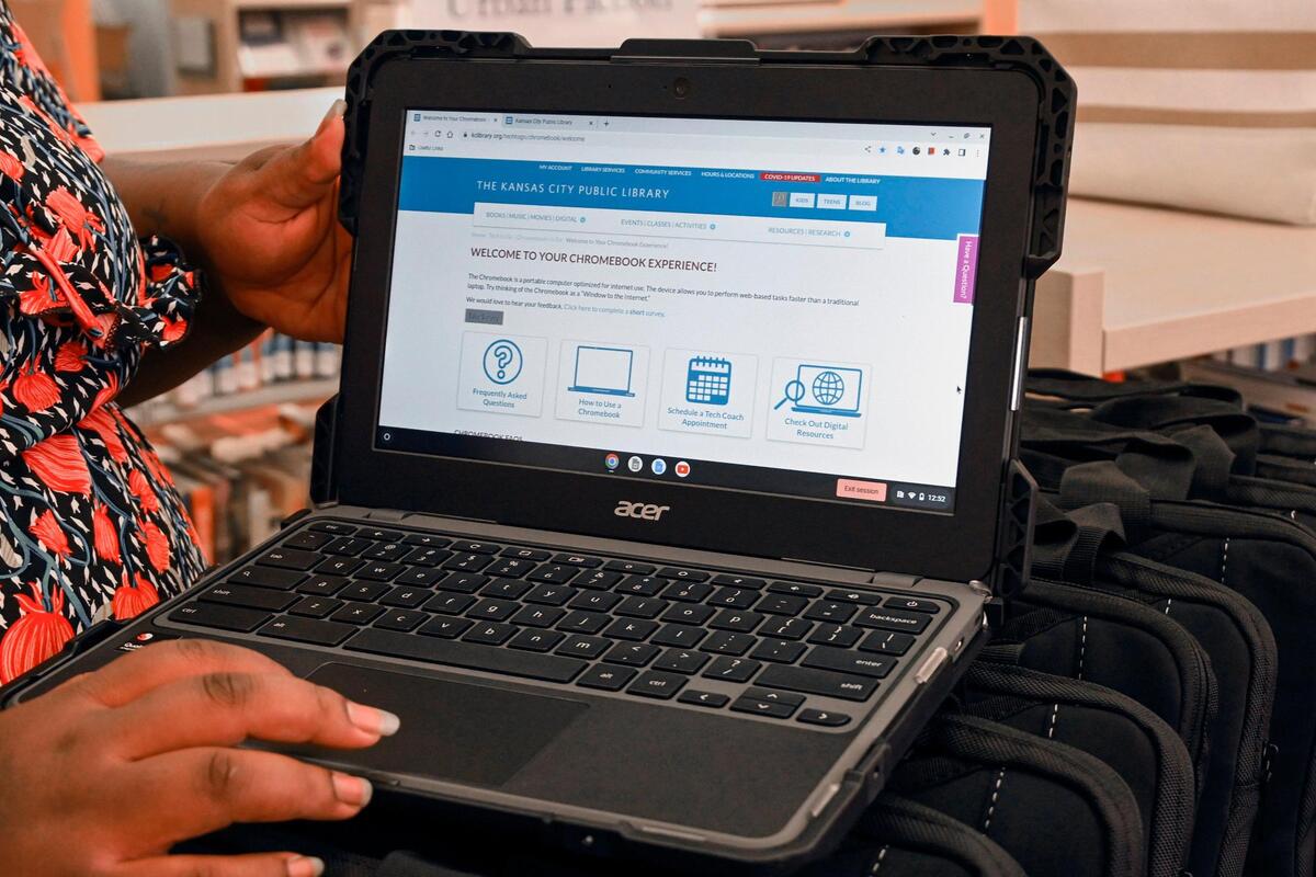 Keyana Branch, assistant branch manager at the Lucille H. Bluford branch of the Kansas City Public Library displayed one of 40 Chromebook computers that are now available from the Kansas City Public Library for patrons to check out for up to 21 days at a time. The computers have a Wi-Fi connection and do not need to have a Wi-Fi at home to use.