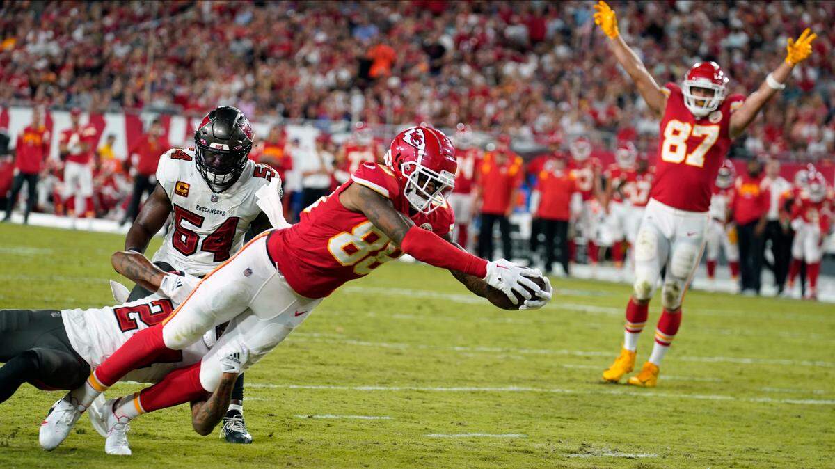 Kansas City Chiefs tight end Jody Fortson (88) dives for a touchdown against Tampa Bay Buccaneers cornerback Carlton Davis III (24) during the second half of an NFL football game Sunday, Oct. 2, 2022, in Tampa, Fla.