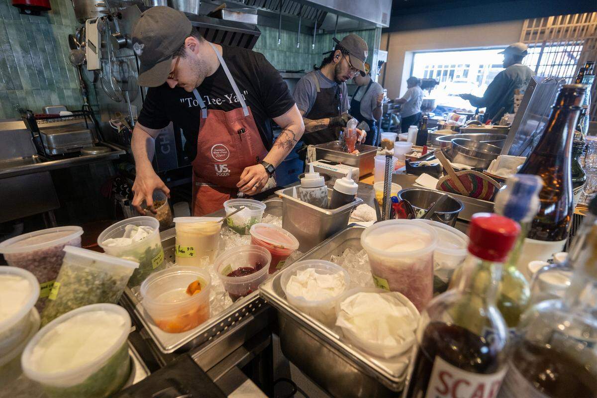 Sam Edelson, center, Anjin's chef de cuisine, and the staff prepare for evening service on Monday, March 16, 2026, at the Kansas City restaurant, a 2026 James Beard Foundation “Best New Restaurant” semifinalist.