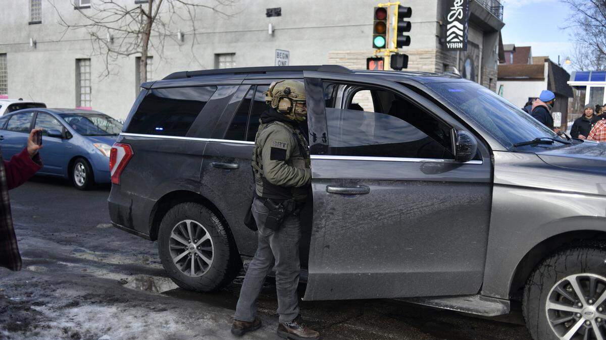 A US Customs and Border Protection agent patrols while looking to detain undocumented persons during immigration enforcement activity in Minneapolis, Minnesota, on Jan. 12, 2026.
