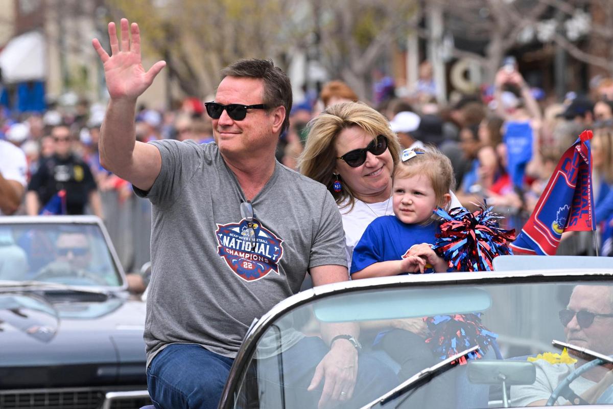 KU Coach Bill Self rides with his wife Cindy and their granddaughter Ella in the Kansas Jayhawks NCAA Championship parade in Lawrence Sunday afternoon.