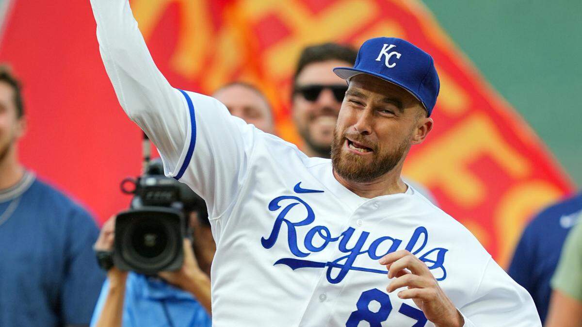 Kansas City Chiefs tight end Travis Kelce throws out the first pitch prior to a game between the Cincinnati Reds and the Kansas City Royals at Kauffman Stadium on June 12, 2023.