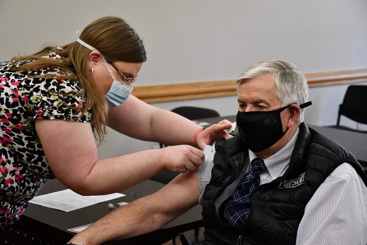 Gov. Mike Parson receives his second dose of the Pfizer vaccine at the Cole County Health Department on March 3, 2021
