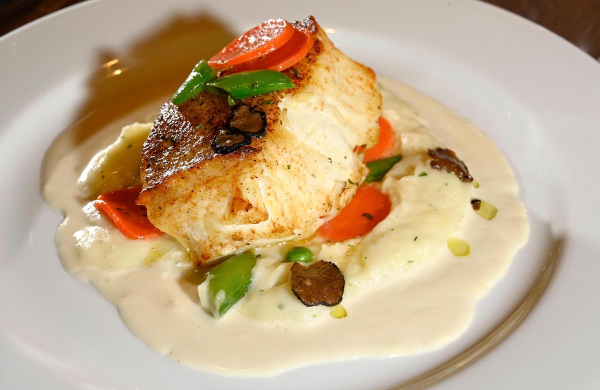 Chilean Sea Bass with whipped potatoes and champagne truffle sauce at Ocean Prime.