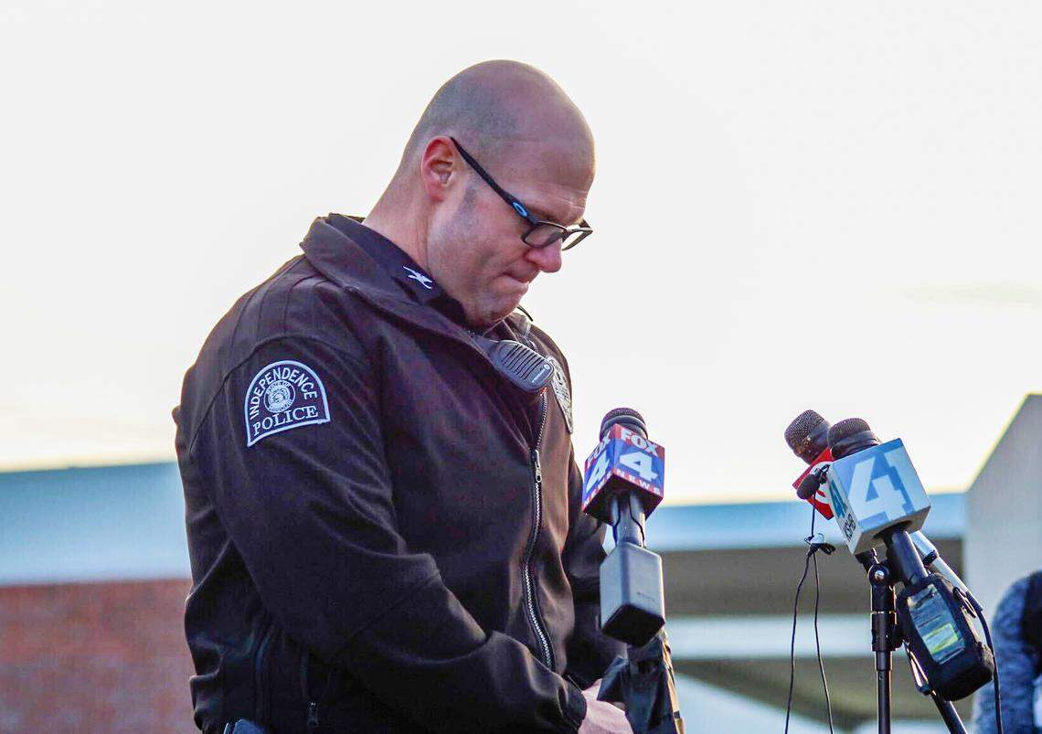 Independence Chief of Police Adam Dustman chokes up Thursday while delivering the news that Independence police officer Cody Allen was one of two people killed in a shooting in the eastern part of the city. The other person killed was civil process server Drexel Mack.