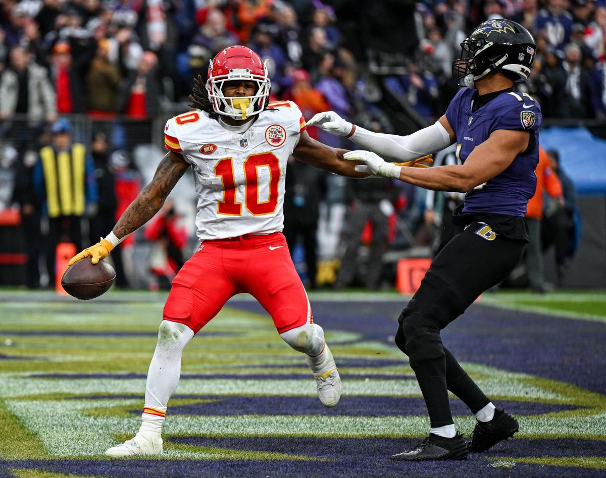 Kansas City Chiefs running back Isiah Pacheco (10) scoots by Baltimore Ravens safety Kyle Hamilton (14) after running in a touchdown in the second quarter Sunday, Jan. 28, 2024, during the AFC Championship Game in Baltimore.