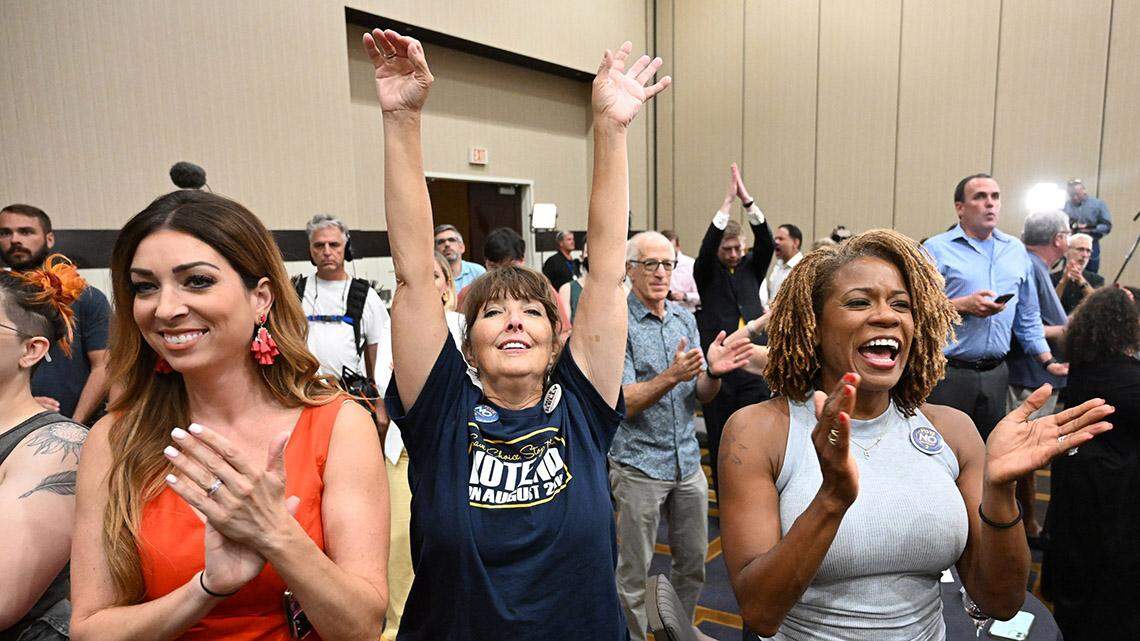 Calley Malloy, left, of Shawnee,  Cassie Woolworth of Olathe and Dawn Rattan of Shawnee applauded the Kansans for Constitutional Freedom and supporters celebrated their win during an election watch party Tuesday, August 2, 2022, at the Overland Park Convention Center, 6000 College Blvd. The group backed a ‘No’ vote on the constitutional amendment, which if passed, removes the right to an abortion from the Kansas constitution.  Moyer is President of the LGBTQ Democractic Caucus.