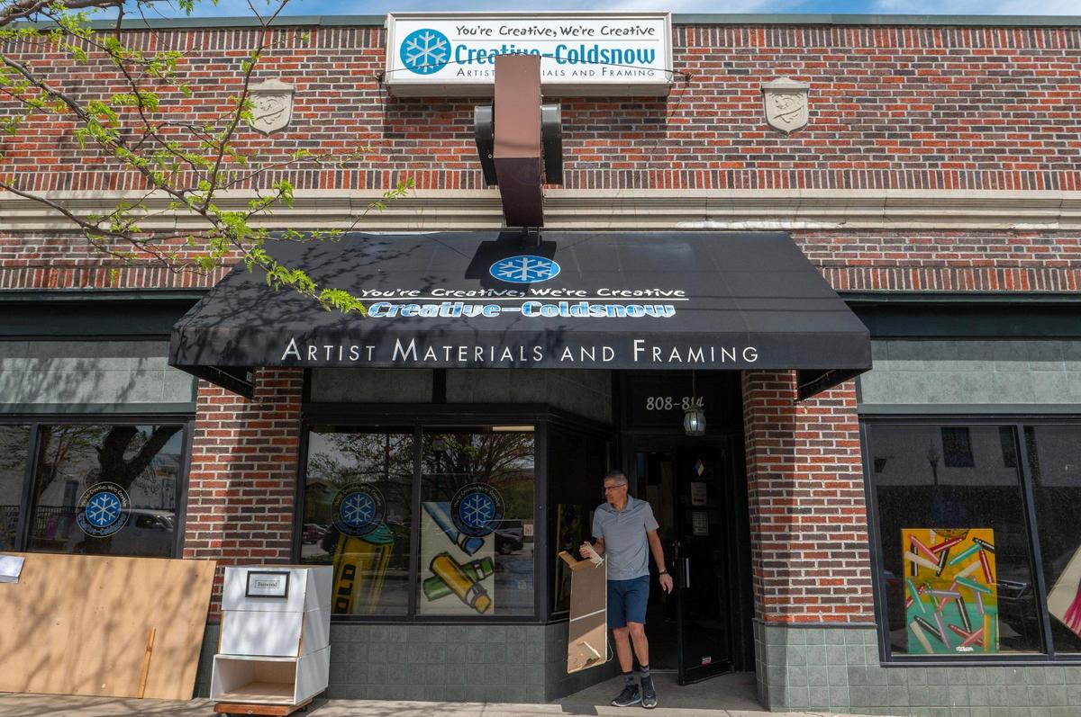 Greg McKean, co-owner of Creative Coldsnow, puts out storing materials.