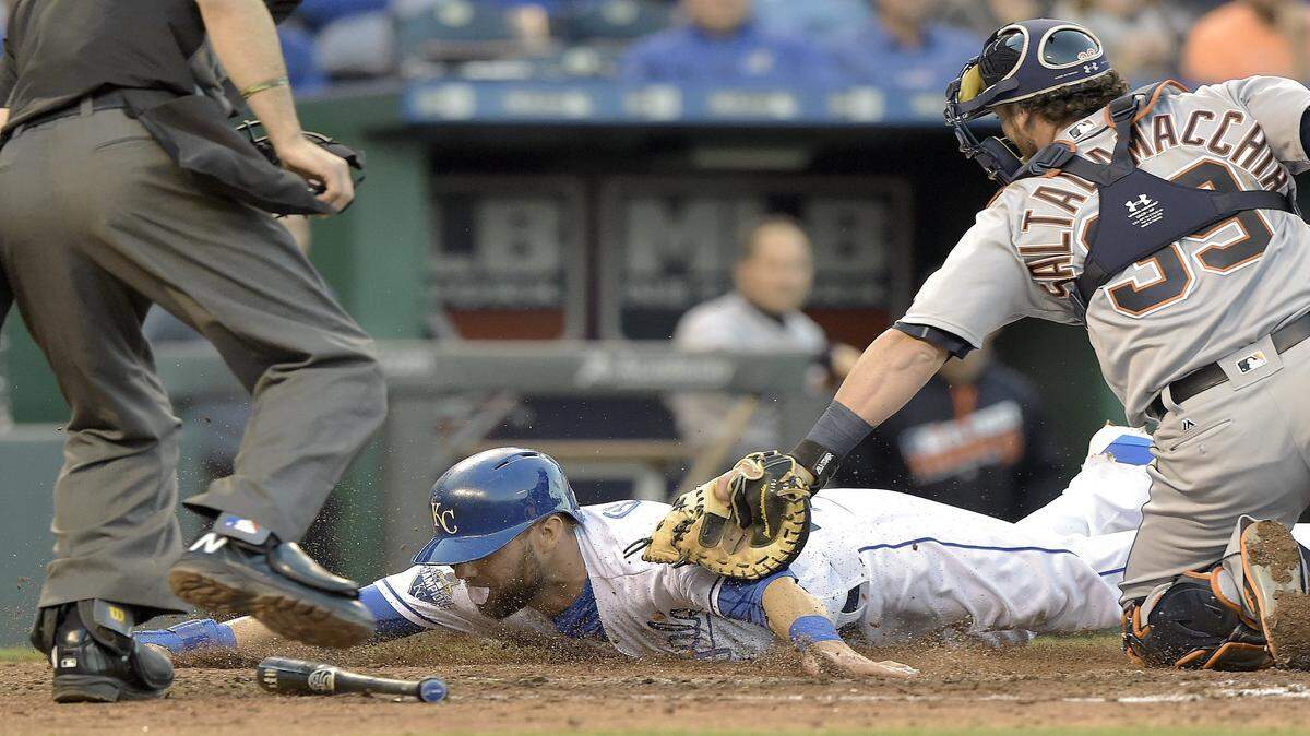 Kansas City Royals' Alex Gordon is tagged out by Detroit Tigers catcher Jarrod Saltalamacchia trying to advance to home on a double play hit into by Kansas City Royals' Jarrod Dyson to end the fifth inning during Wednesday's baseball game on April 20, 2016 at Kauffman Stadium in Kansas City, Mo.