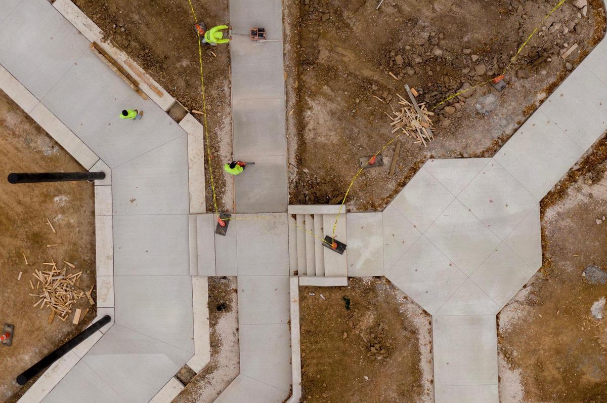 New concrete is poured and worked on as part of a $3.7 million renovation underway on Wednesday, Nov. 15, 2023, at Gum Springs Park in Shawnee.