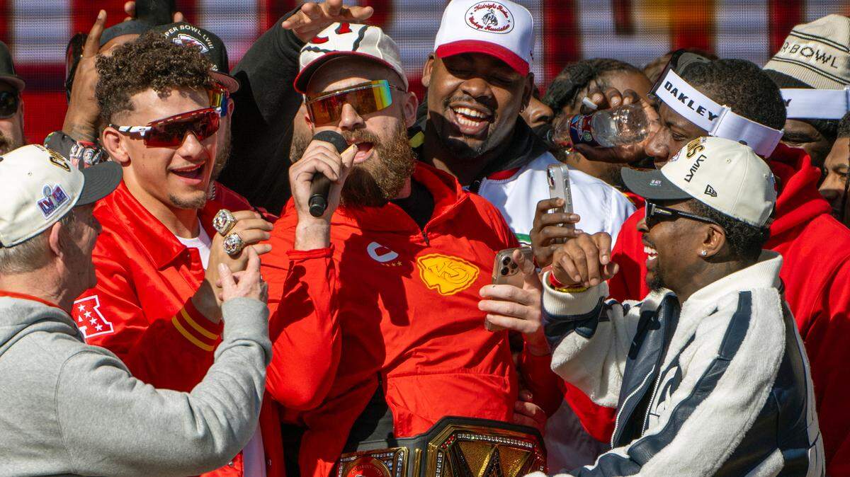 The guy with the microphone, Kansas City Chiefs tight end Travis Kelce, showed his famous girlfriend the raunchy bro comedy “American Pie” on a date night, she reveals in her new song “So High School.”