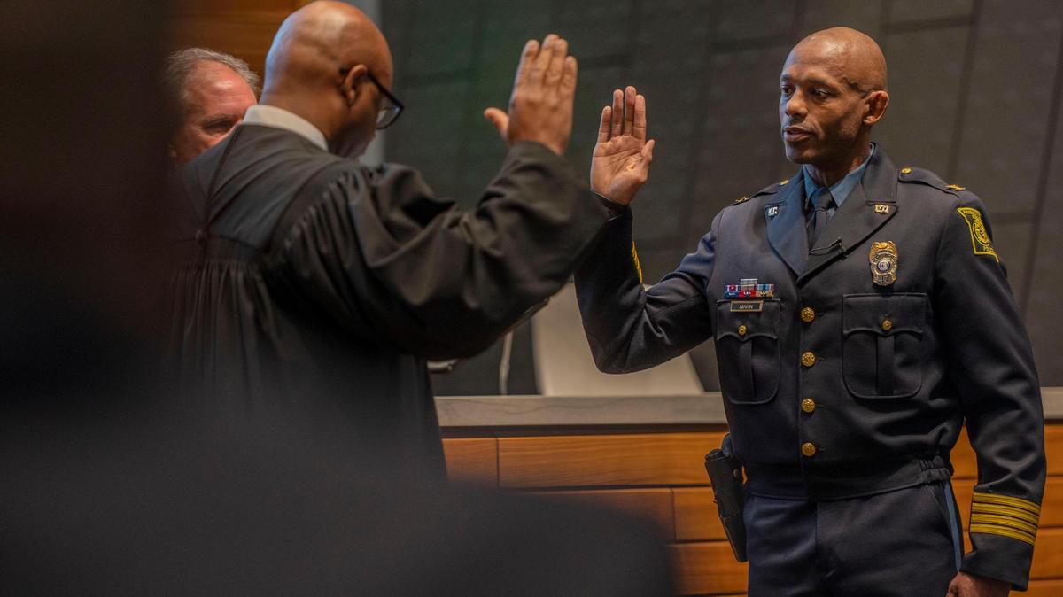 Deputy Chief Joseph Mabin is sworn in as the Interim Chief of Police by Jackson Court Circuit Judge Kevin Harell during the swearing-in ceremony Friday at police headquarters.