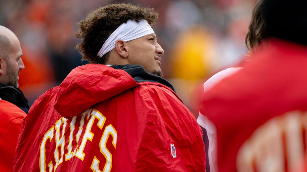 Kansas City Chiefs quarterback Patrick Mahomes (15) stands for the national anthem before an NFL football game against the Denver Broncos at Empower Field at Mile High on Sunday, Oct. 29, 2023, in Denver.