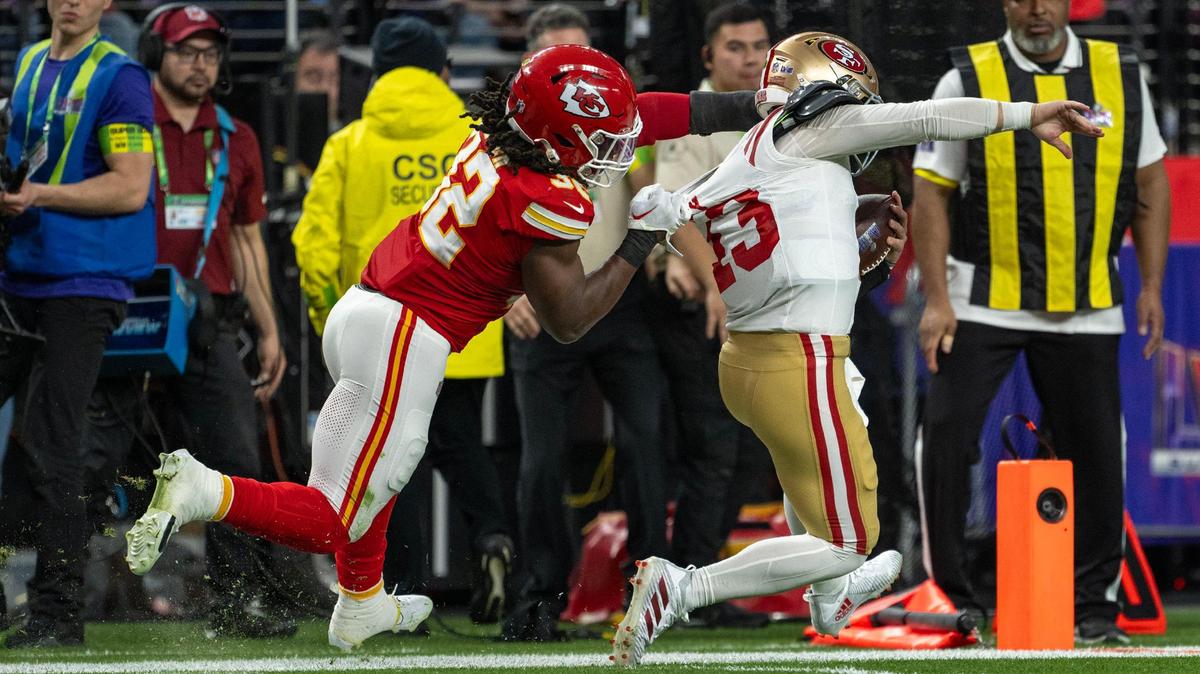 Kansas City Chiefs linebacker Nick Bolton (32) grabs the back of the jersey of San Francisco 49ers quarterback Brock Purdy (13) during the second quarter of Super Bowl LVIII on Sunday, Feb.11, 2024, in Las Vegas.