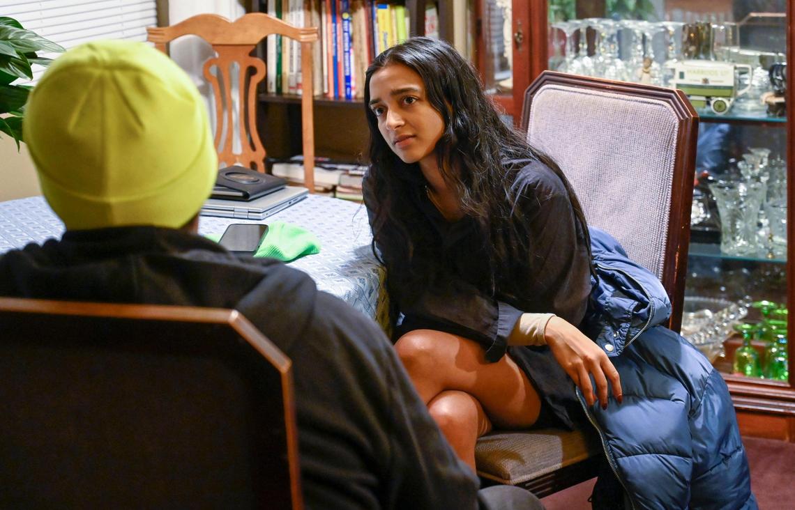 Tara Raghuveer, founding director of KC Tenants, listened Monday as Brian Hullaby described housing issues residents are facing at Parade Park, a Black-owned cooperative housing community in Kansas City. Hullaby, a leader with KC Tenants who represents Parade Park, said the co-op has fallen into mismanagement.