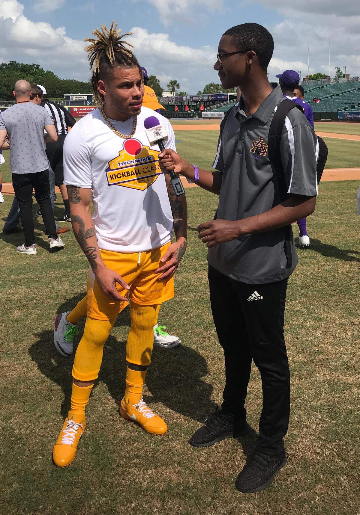 For Tyrann Mathieu, left, trips home to New Orleans are an important part of his giving back to members of the community who raised him and remain largely his biggest fans.