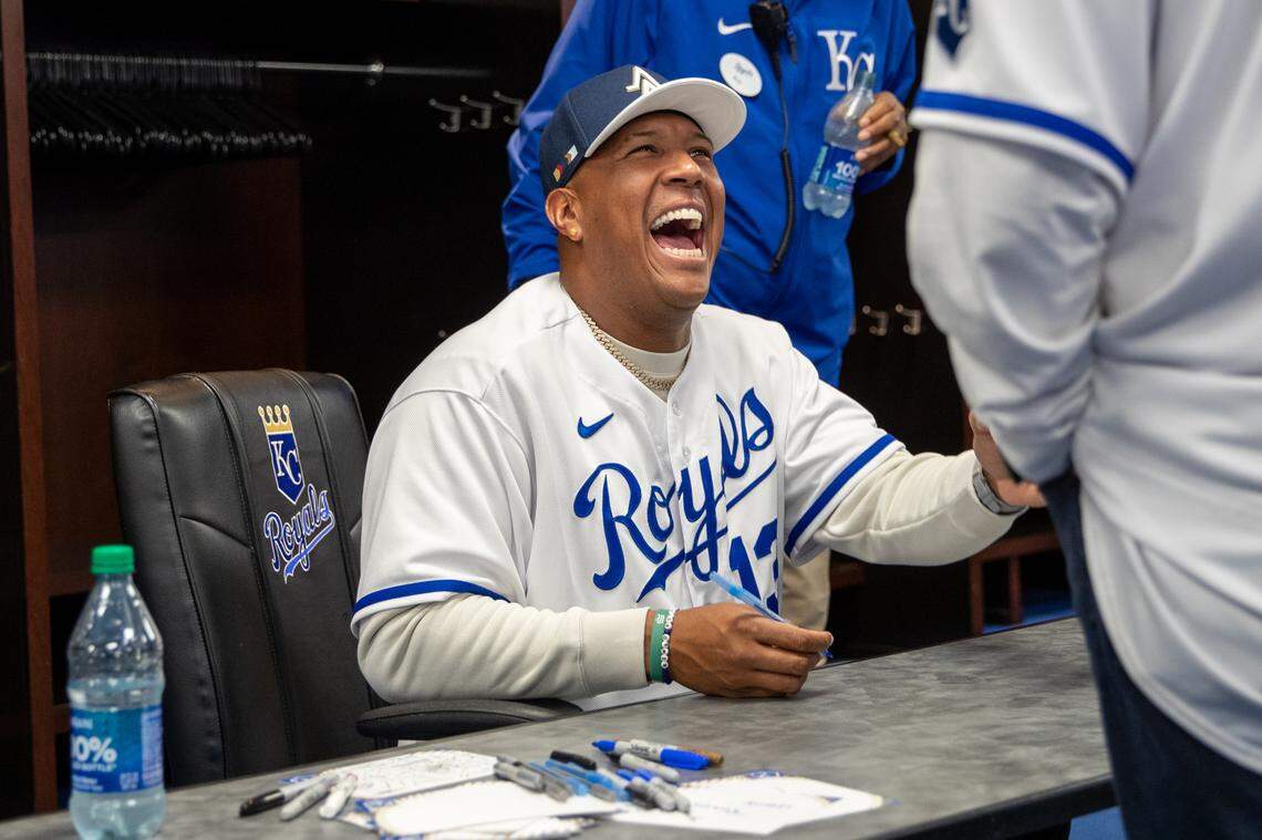 Kansas City Royals catcher Salvador Perez laughs while signing at autographs at the Royals Rally on Saturday, Feb. 3, 2024, at Kauffman Stadium.