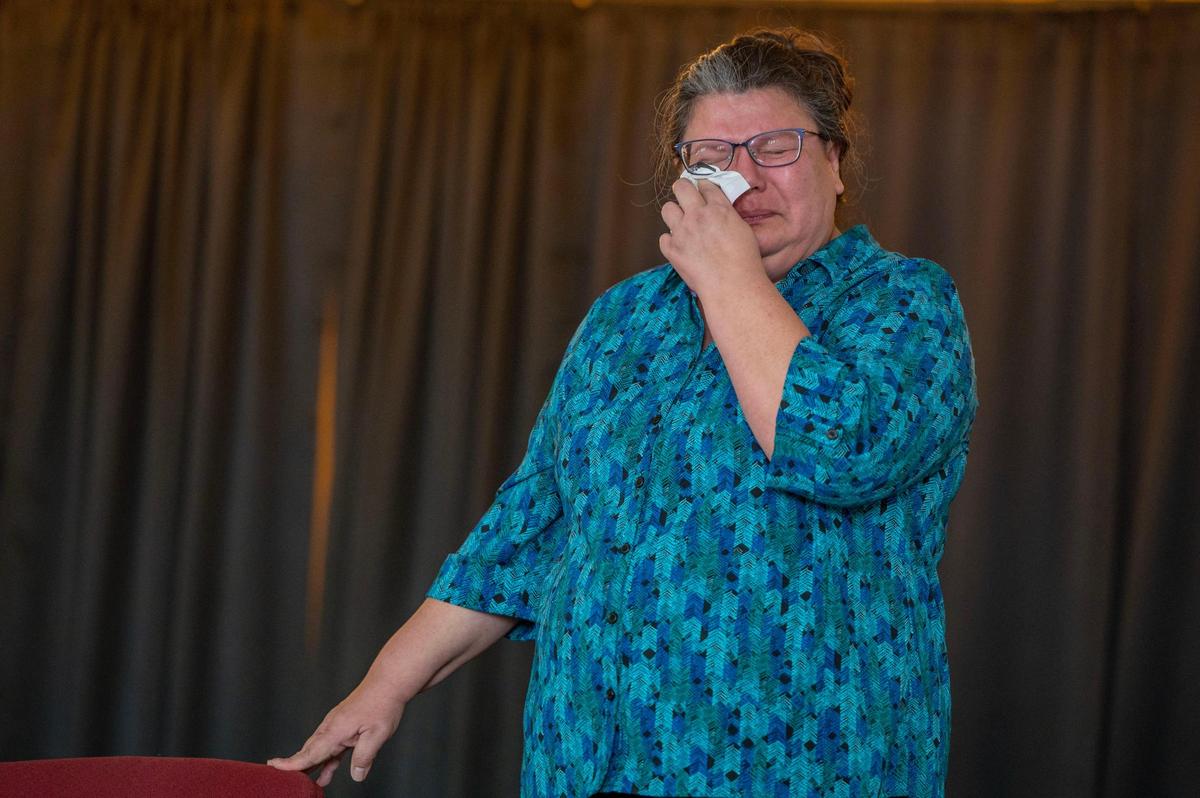 Executive Director of Kansas City Indian Center Gaylene Crouser, becomes emotional while speaking about native children in boarding schools during an event honoring indigenous people hosted by the Clay Countians for Inclusion at Garrison School on Saturday, Nov 5, 2022, in Liberty.