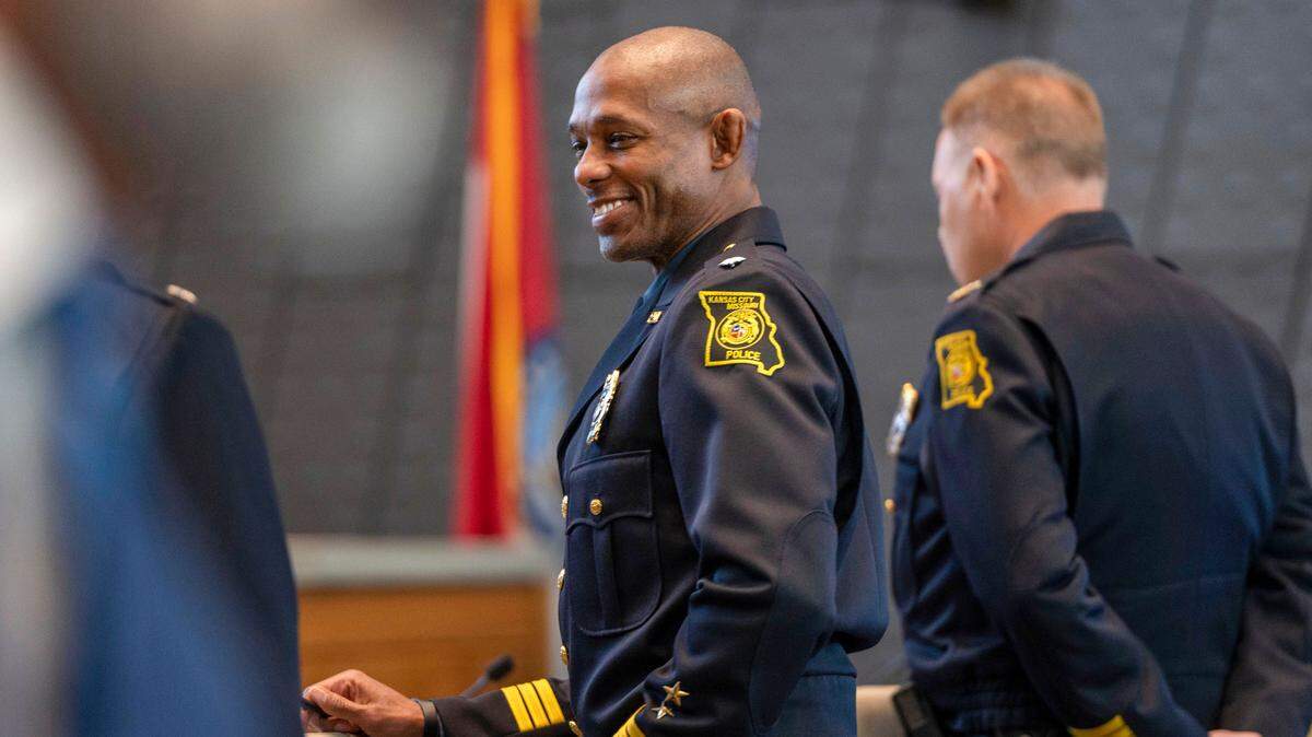Interim Kansas City Police Chief Joseph Mabin, left, shown during his swearing in ceremony before the Board of Police Commissioners meeting in April, may serve in the interim position for a while. Police commissioners could take up to a year to find a replacement for former chief Rick Smith, seen at right.