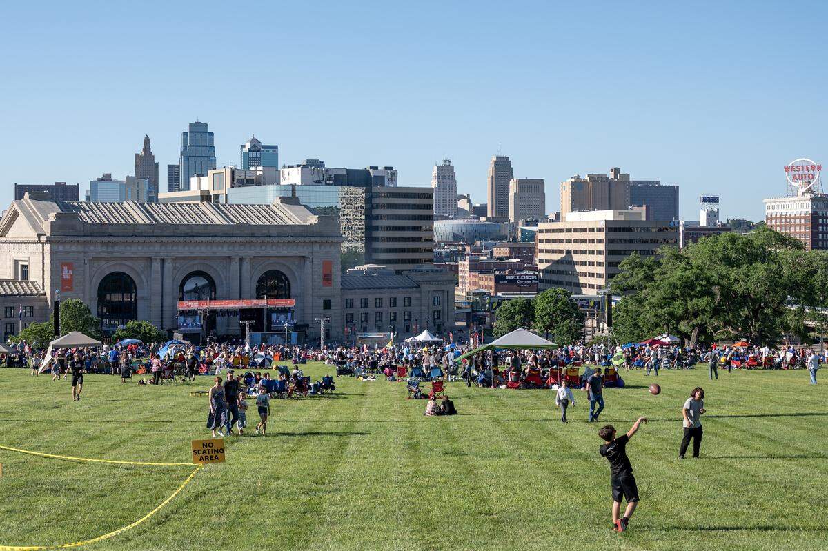 People gather on the North Lawn of the National WWI Museum and Memorial during the Kansas City Symphony's annual Celebration at the Station concert at Union Station on Sunday, May 24, 2026, in Kansas City.