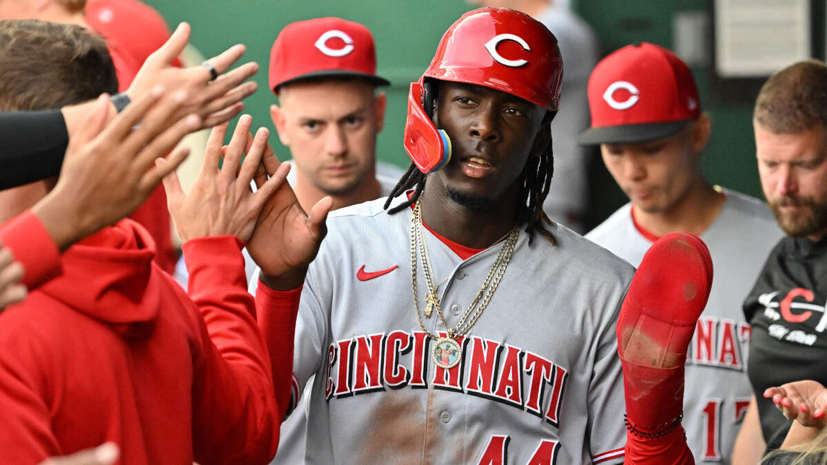 Cincinnati Reds shortstop Elly De La Cruz (44) celebrates in the dugout after scoring a run in the first inning of Tuesday’s game against the Kansas City Royals at Kauffman Stadium.