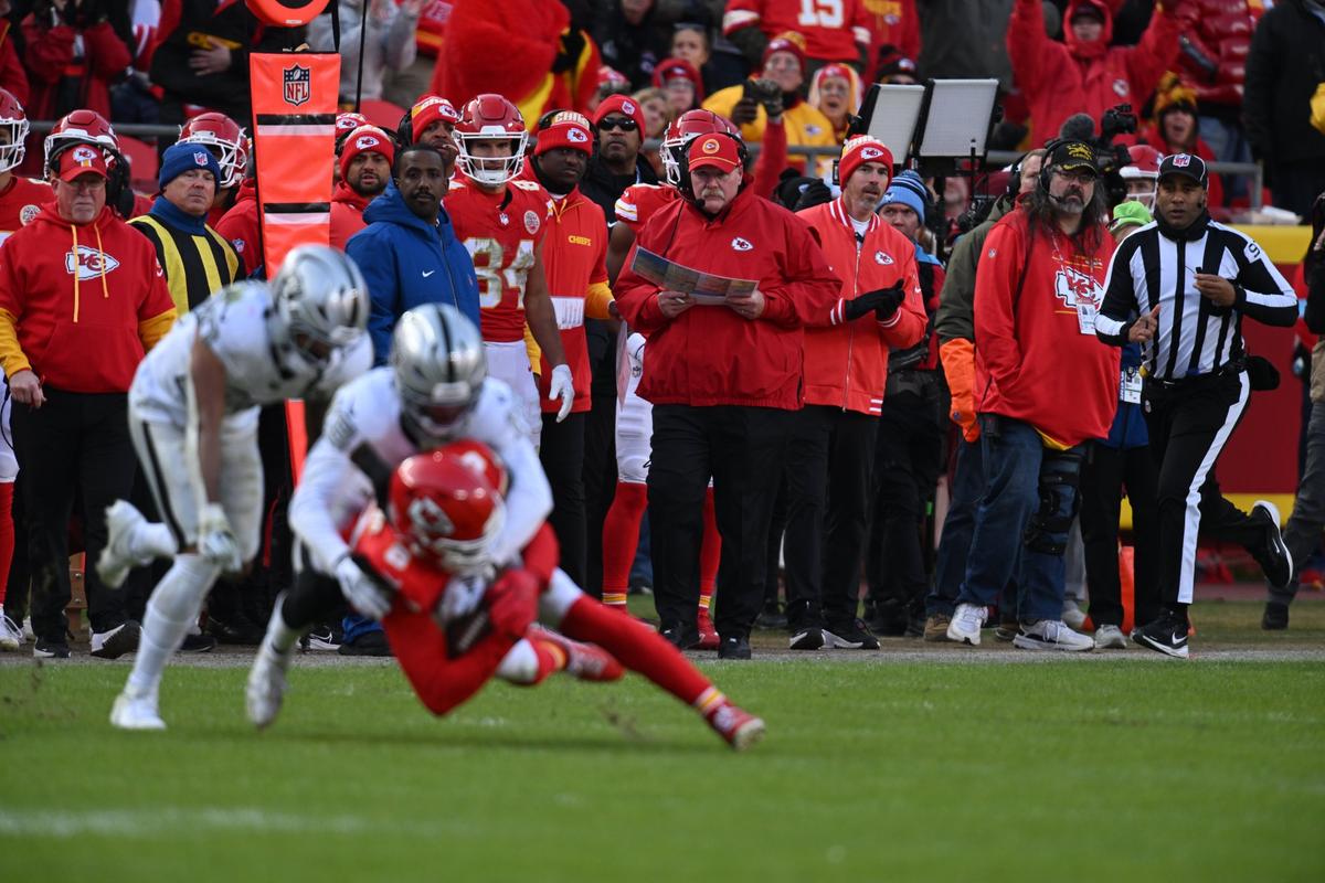 Kansas City Chiefs Head Coach Andy Reid watches as Kansas City Chiefs wide receiver DeAndre Hopkins makes a catch in the first half of the Chiefs game vs. the Las Vegas Raiders on Friday, Nov. 29, 2024, at GEHA Field at Arrowhead Stadium.