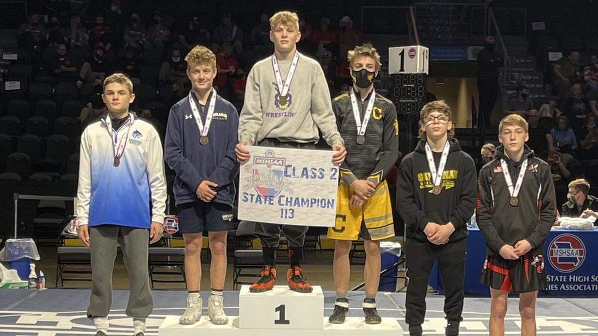 Pleasant Hill’s Sam Ewing topped the podium Thursday at 113 pounds, winning a state championship at Cable Dahmer Arena in Independence. His title was part of Pleasant Hill’s team-title showing this week.