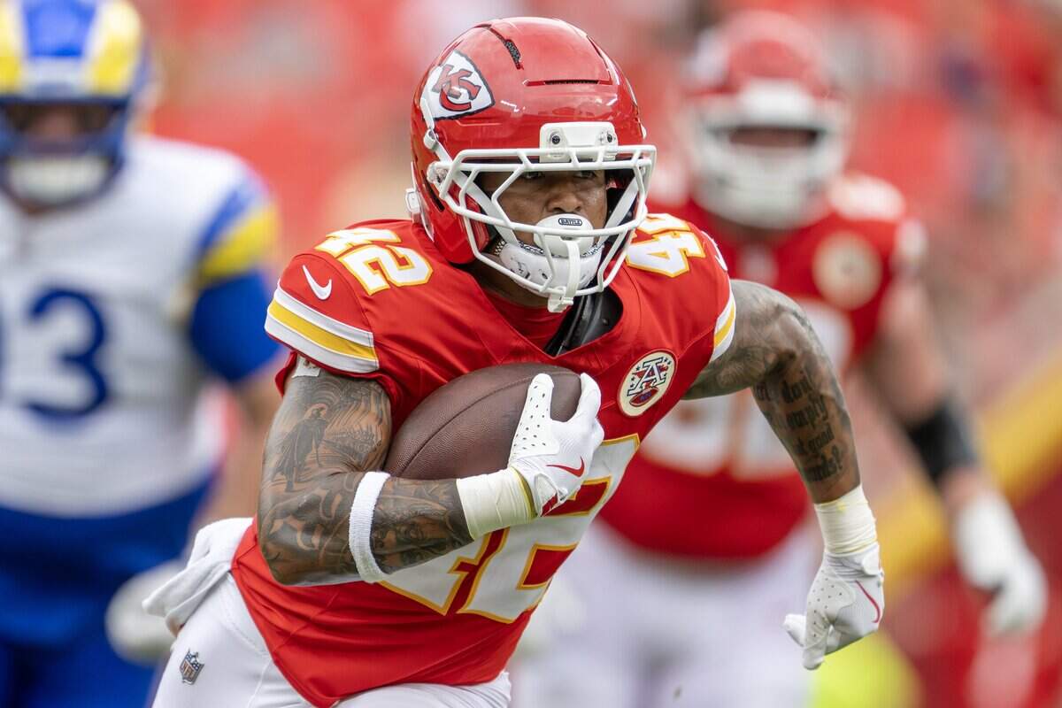 Kansas City Chiefs running back Jaydn Ott (42) runs the ball in the fourth quarter during an NFL preseason game against the Los Angeles Rams at Arrowhead Stadium on Saturday, Aug. 15, 2026, in Kansas City.