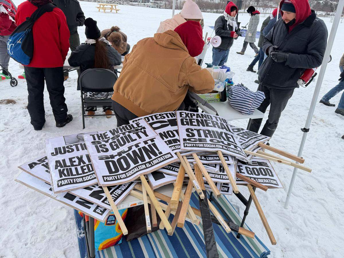 Signs await protesters arriving at a demonstration at the National World War I Museum and Memorial in Kansas City to object to Immigration and Customs Enforcement actions across the country.