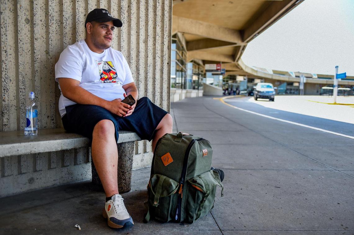 Carlos Barragan of Kansas City waits for a ride at KCI after arriving home Wednesday, Aug. 5, 2020, from a business trip. Barragan, who said he was a little nervous to travel, sells personal protective equipment to large companies.