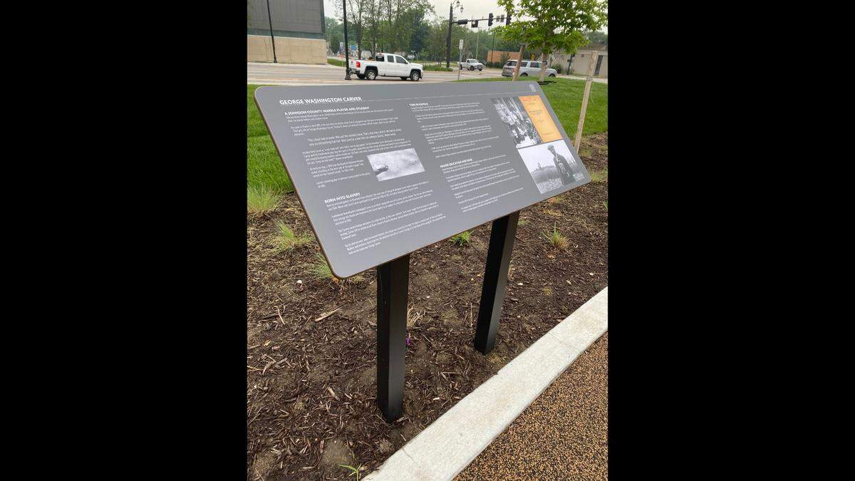 The Johnson County History Plaza and Square includes this information board about noted American scientist and inventory George Washington Carver, who attended school nearby.