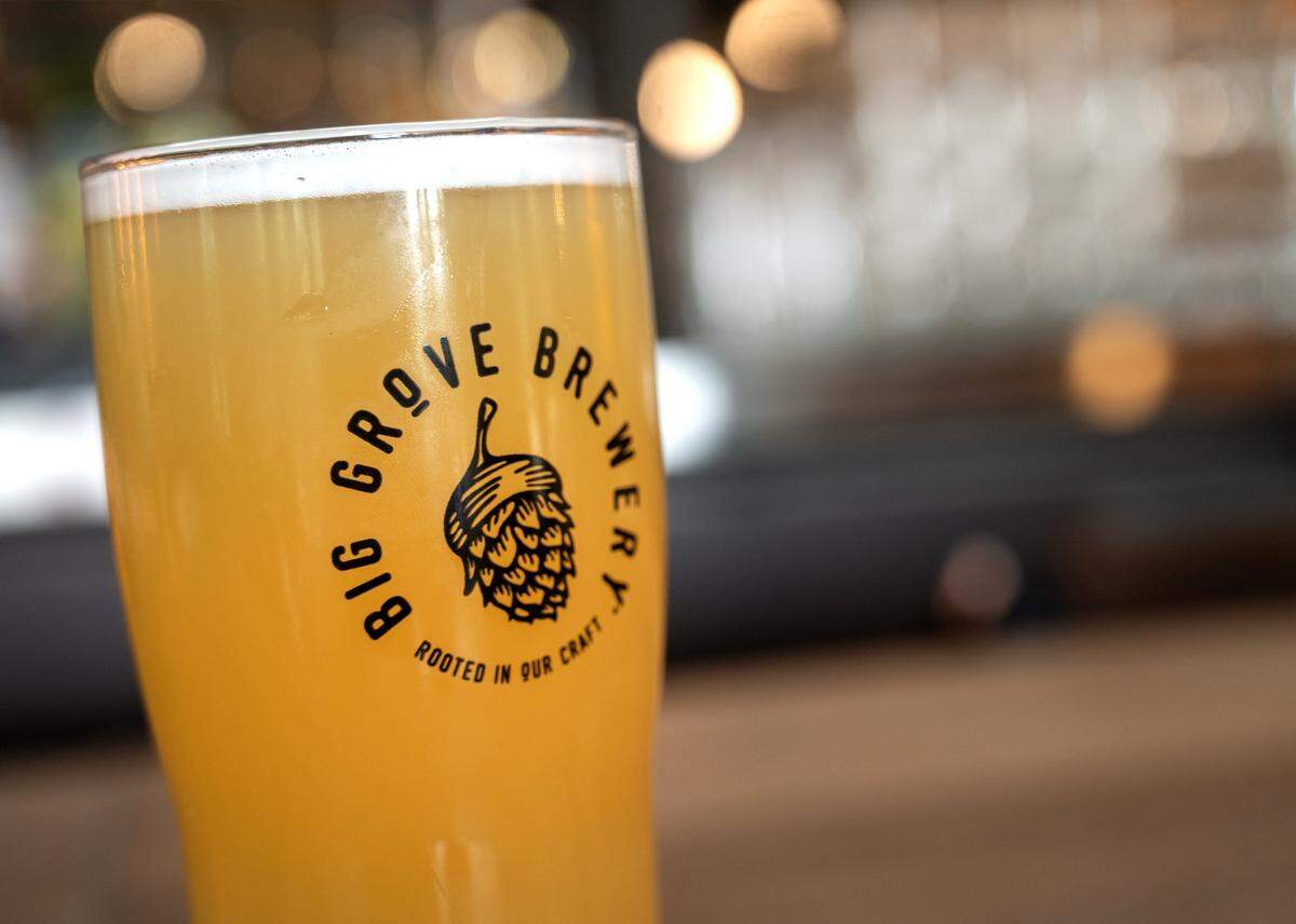 A glass of Easy Eddy, a flagship hazy IPA, sits on the bar at Big Grove Brewery in Prairie Village, on Thursday, May 14, 2026. The Iowa-based brewery is preparing to open its 12,000-square-foot taproom and restaurant in the former Macy's building at 7060 Mission Rd. on May 21.