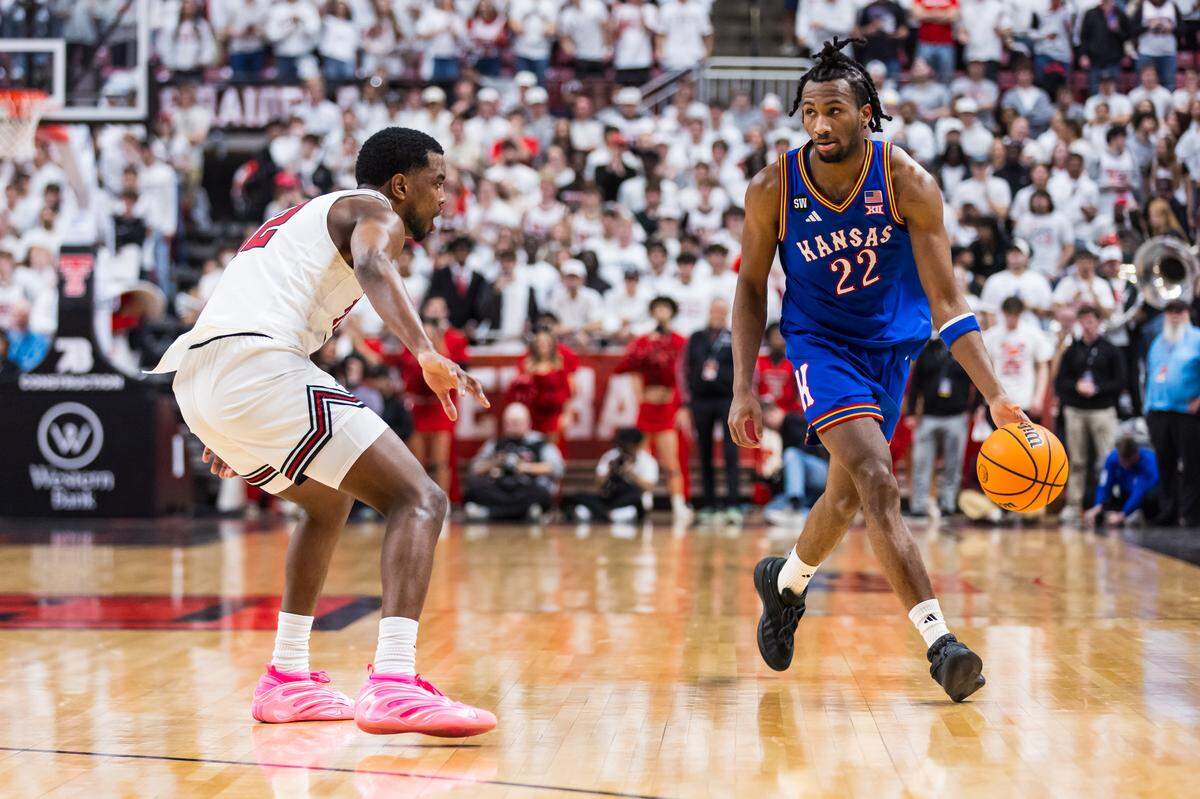 Darryn Peterson #22 of the Kansas Jayhawks handles the ball against Donovan Atwell #12 of the Texas Tech Red Raiders during the first half of the game at United Supermarkets Arena on Feb. 2, 2026 in Lubbock, Texas.