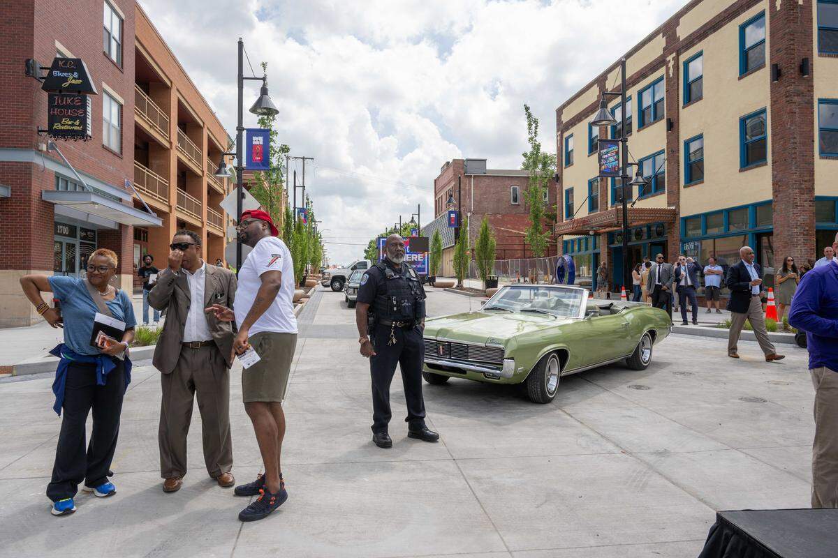 People gather around the re-opening of the pedestrian mall in the 18th & Vine Jazz District on Wednesday, May 27, 2026, in Kansas City.
