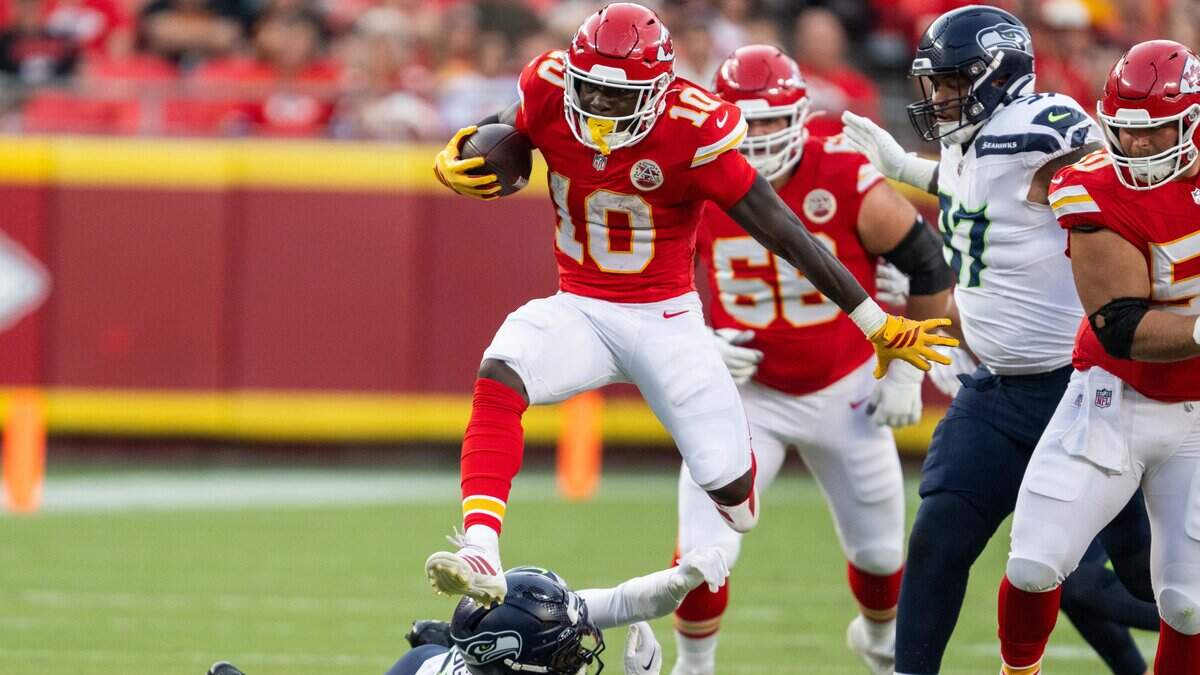 Kansas City Chiefs running back Emmett Johnson (10) hurdles a defender in the first half of the Chiefs preseason game vs. the Seattle Seahawks, on Friday, August 28, 2026, at Arrowhead Stadium.