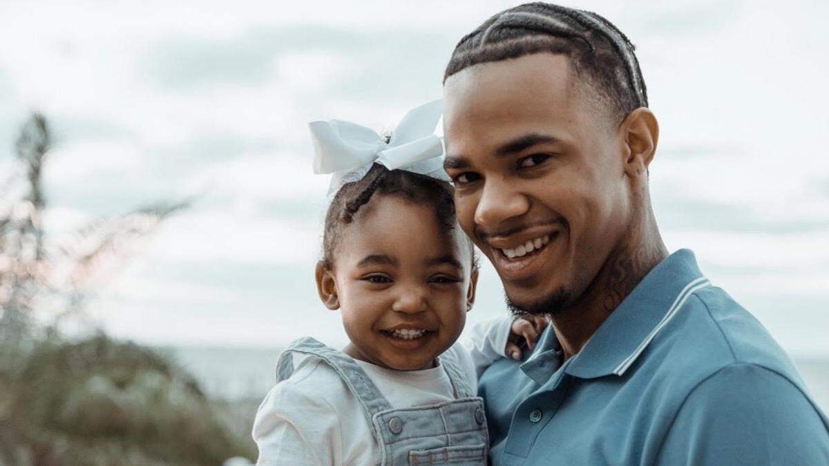 Cardell Crawford, 24, with daughter Mayumi.