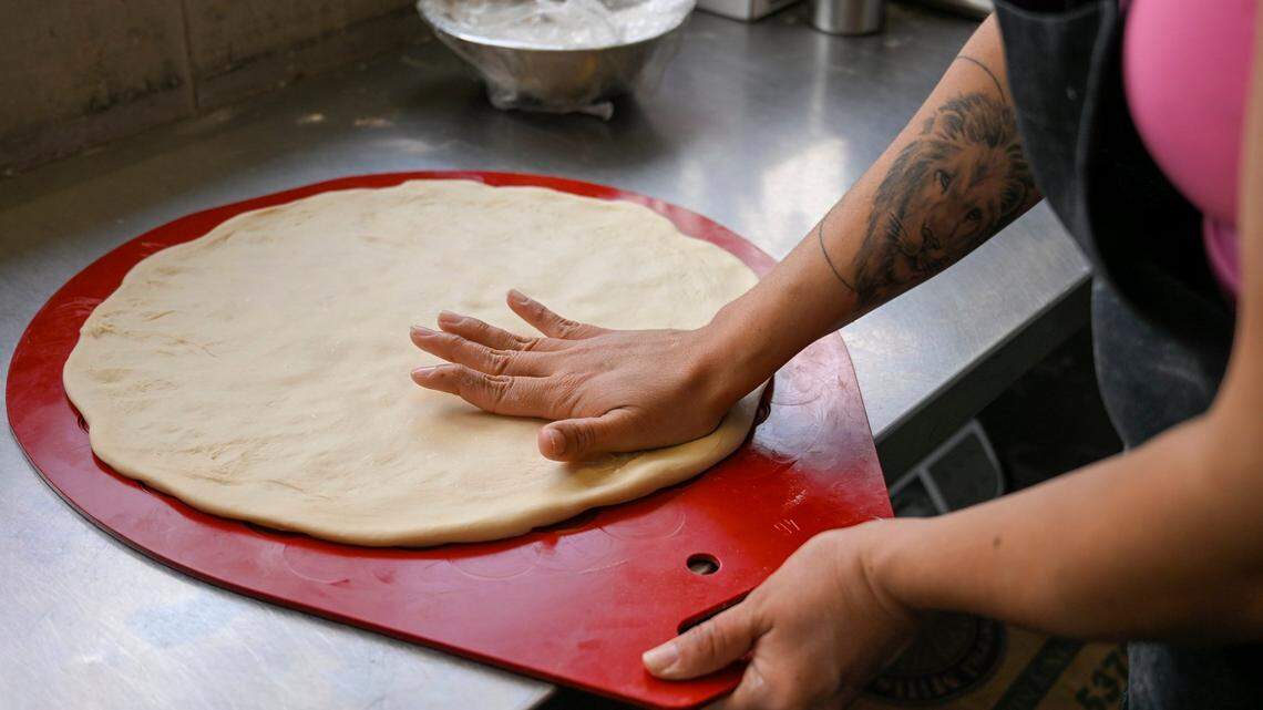 Dough for Sonora-style flour tortillas is pressed out by hand at Yoli Tortilleria.