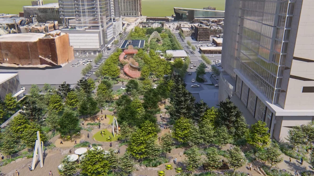 A screenshot of a video produced by supporters of the south loop project shows a rendering of what a cap on I-670 that is covered in green space and pedestrian walkways might look like as it runs through downtown Kansas City. This view is looking east from Wyandotte Street.