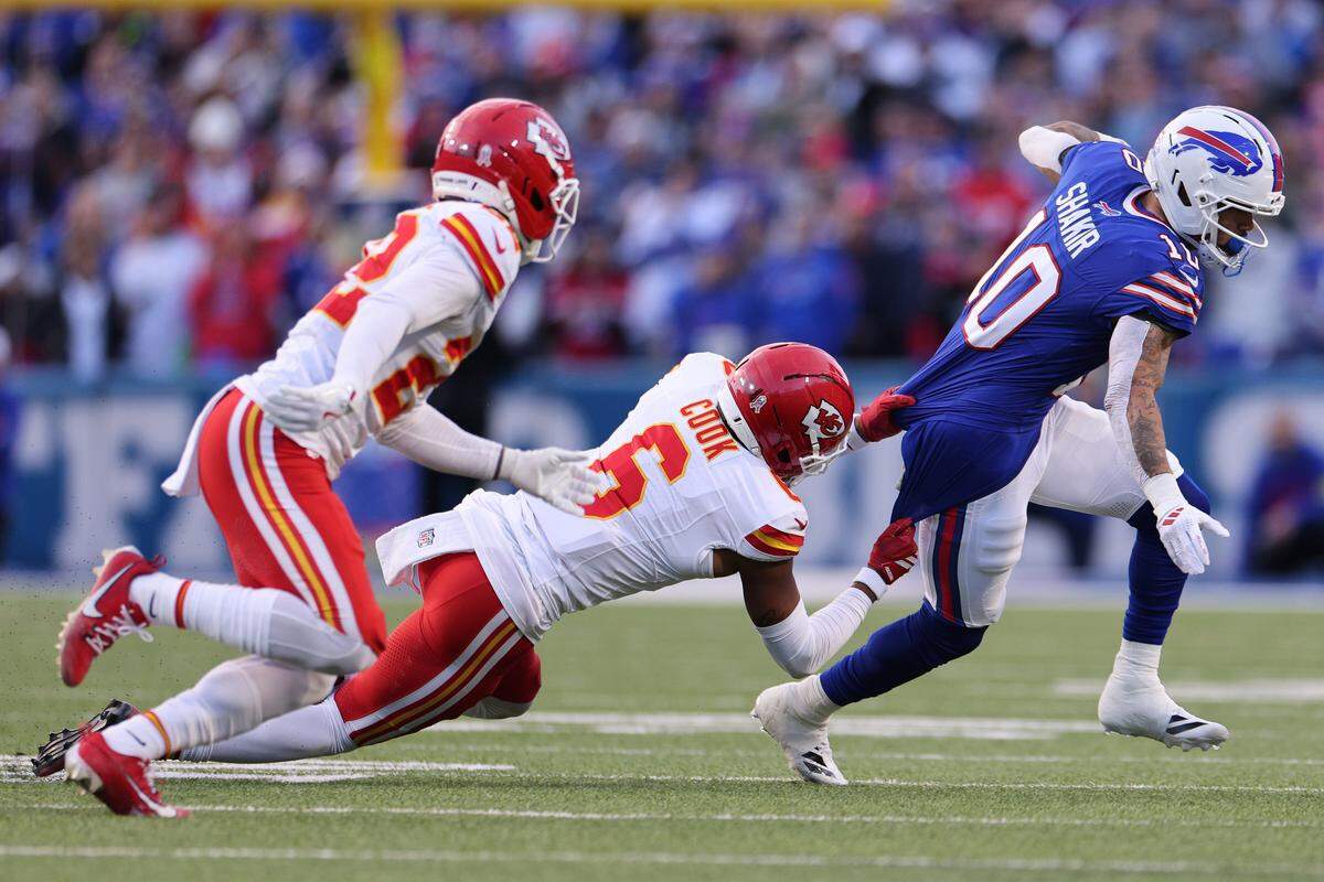Buffalo Bills receiver Khalil Shakir (No. 10) tries to escape the grasp of Kansas City Chiefs safety Bryan Cook during an NFL Week 9 game at Highmark Stadium in Orchard Park, New York, on Sunday, Nov. 2, 2025.