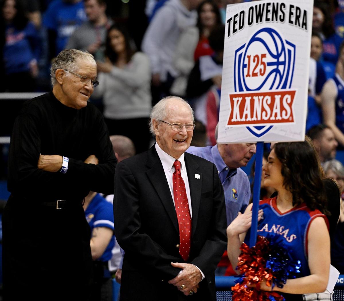 Former KU coach Ted Owens (right) and former KU great, Walt Wesley (left) took part in a halftime ceremony Jan. 14, 2023, on honoring players celebrating KU’s 125th year in college basketball.