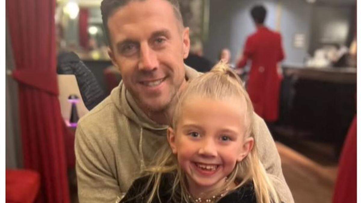 Alex Smith with his daughter Sloane.