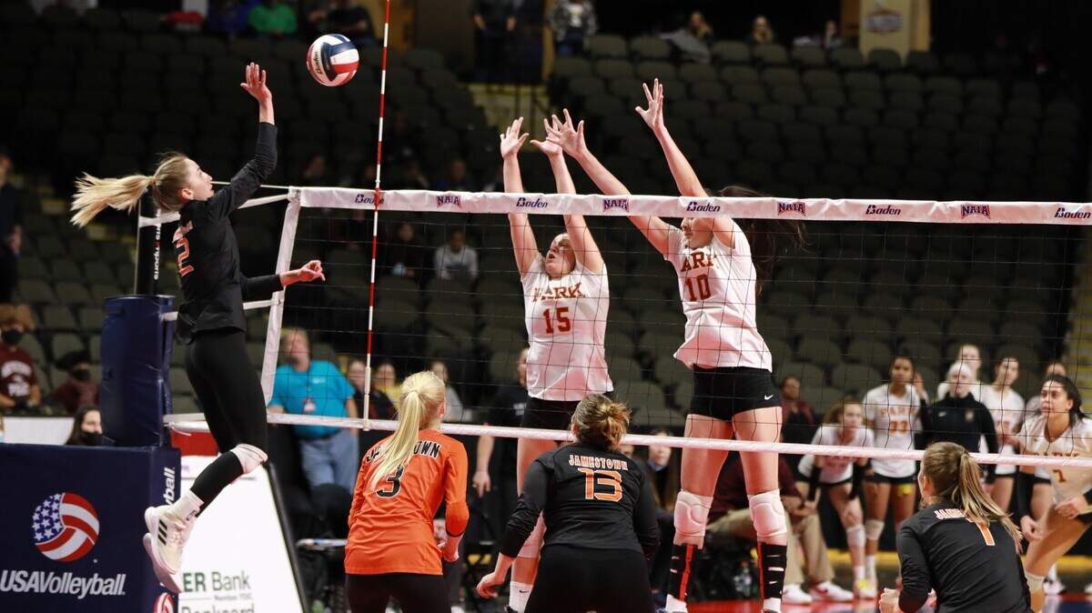 A pair of Park players (right) go up for the block in a NAIA national semifinal against Jamestown (N.D.) on Friday, Dec. 3, 2021, in Sioux City, Iowa. Park won in straight sets and will play for the championship on Saturday.