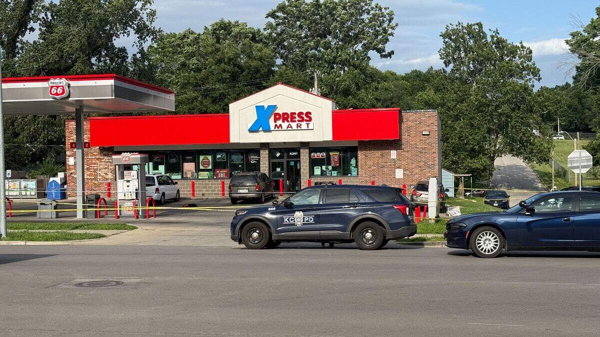 Kansas City police vehicles surround the Xpress Mart gas station at 4341 Paseo Blvd. following a shooting that left one man dead.