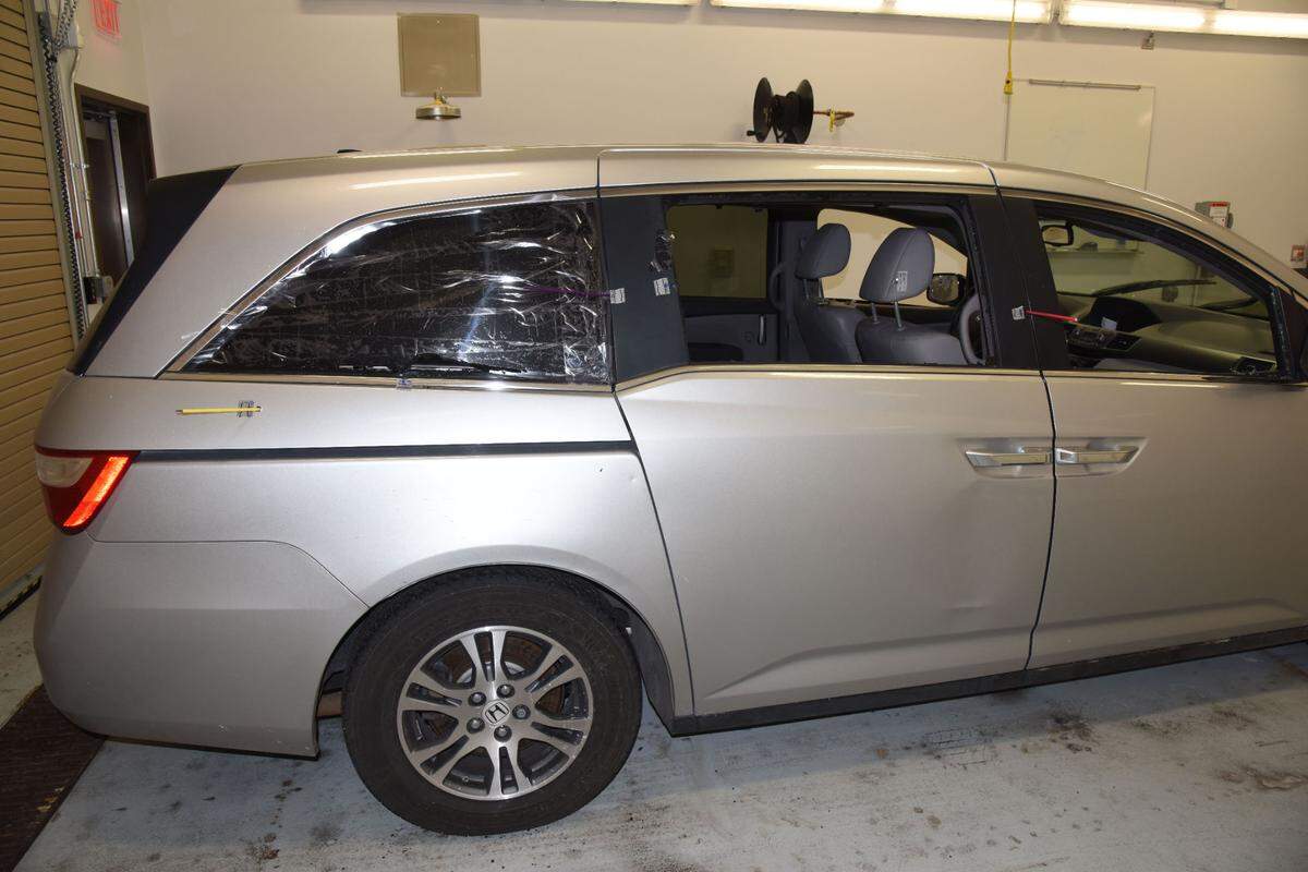 An evidence photo from the 2018 police shooting of John Albers in Overland Park show where a bullet fired by police exited near the rear of the vehicle.
