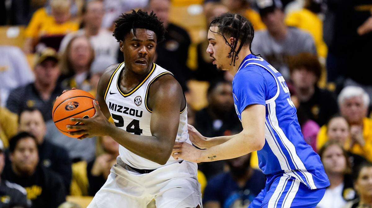 Missouri Tigers guard Kobe Brown (24) looks to pass as Kentucky Wildcats forward Lance Ware (55) defends during the second half at Mizzou Arena in Columbia on Dec. 28, 2022.