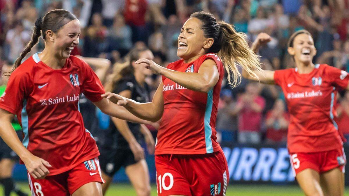Kate Del Fava, from left, Lo LaBonta and Cece Kizer celebrate a KC Current victory during a match last season at Children’s Mercy Park in Kansas City, Kan.